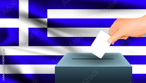 Male hand puts down a white sheet of paper with a mark as a symbol of a ballot paper against the background of the Greece flag. Greece the symbol of elections