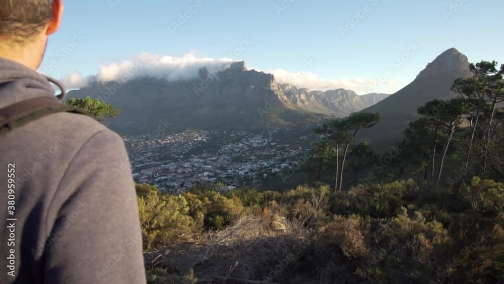 Man walking at Signal Hill towards Table Mountain in Cape Town in Slow Motion Man walking at Signal Hill towards Table Mountain in Cape Town in Slow Motion