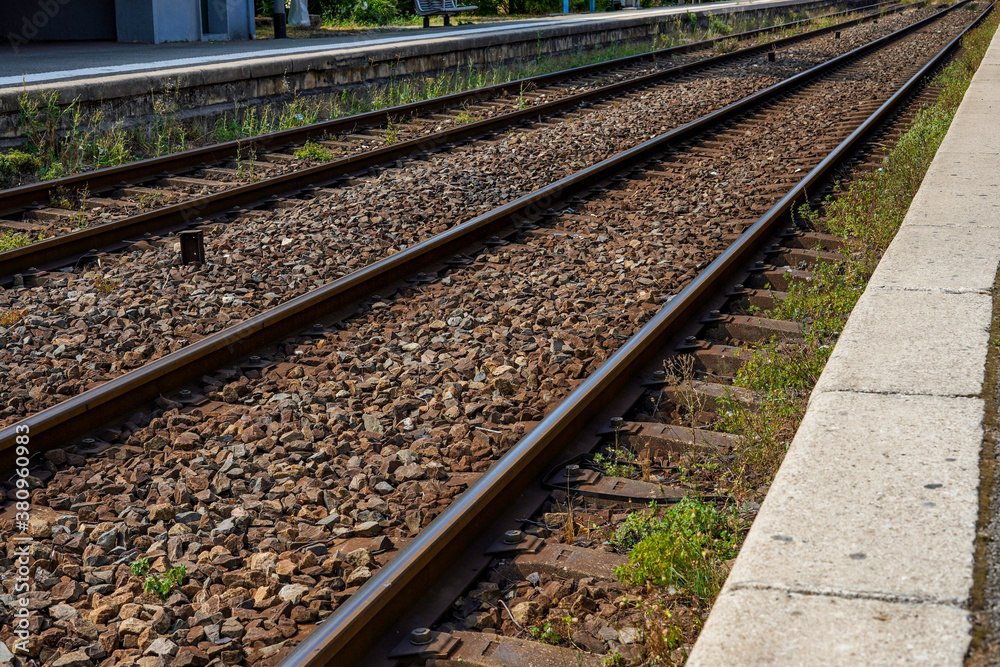 Train station. Railway or railroad tracks for train transportation. Train station. Railway or railroad tracks for train transportation.