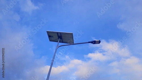 A light bulb with a solar cell on top