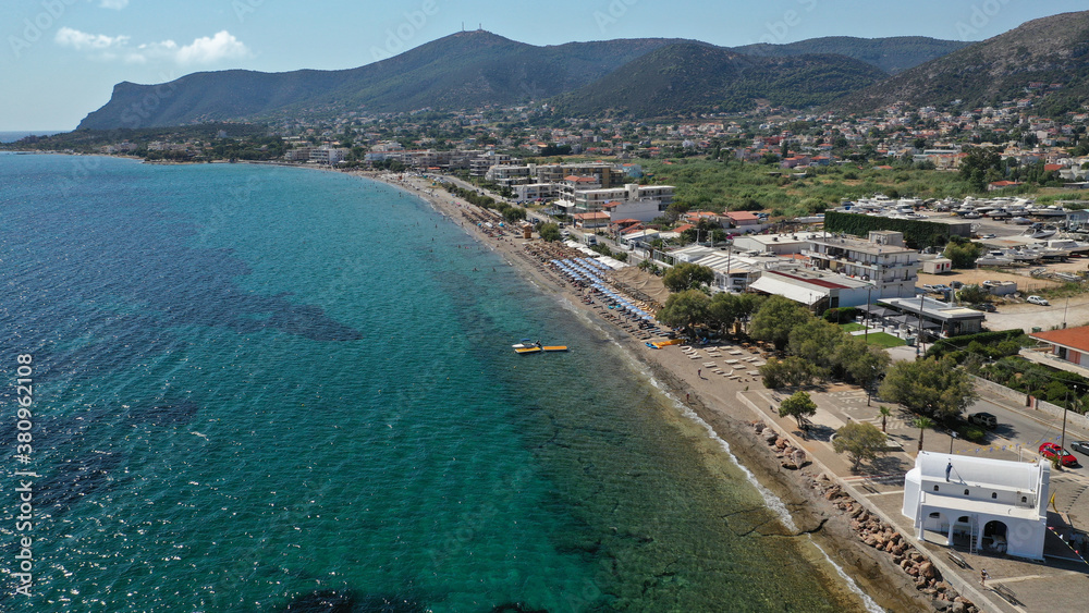 Aerial drone top down photo of organised crystal clear sea beach in Mediterranean popular destination