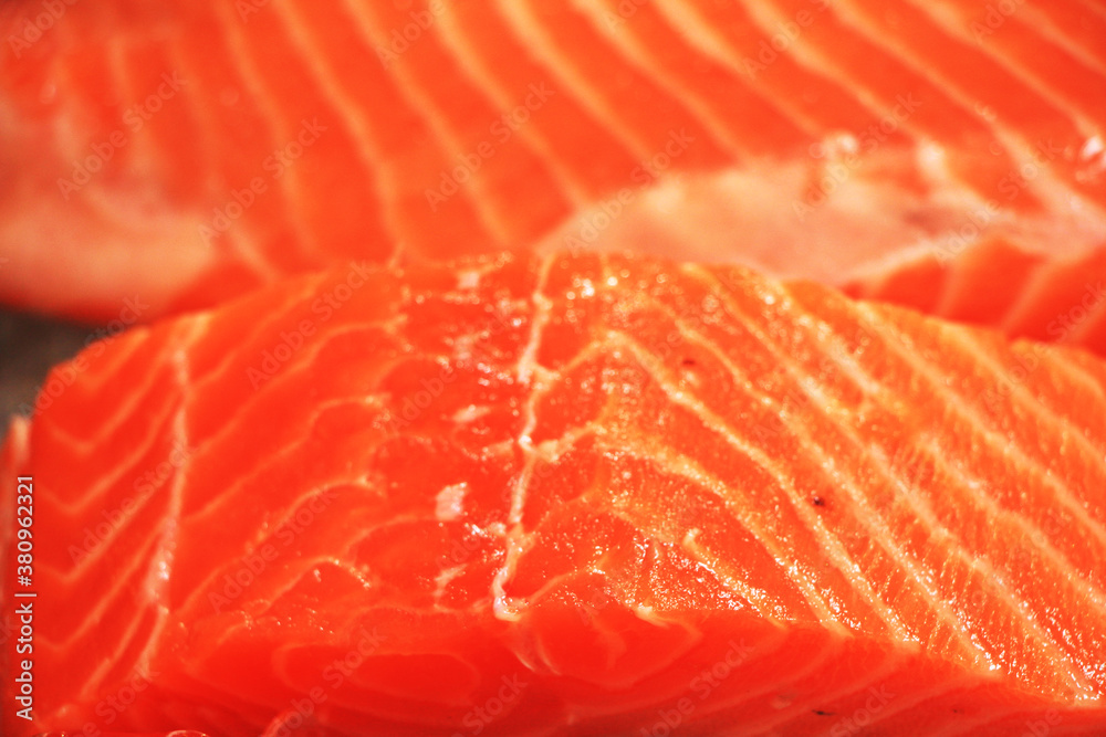 Fresh red salmon fillets and fatty strands inserted between the meat. Slides are beautifully sized pieces that are appetizing. Fresh red salmon fillets and fatty strands inserted between the meat. Slides are beautifully sized pieces that are appetizing.