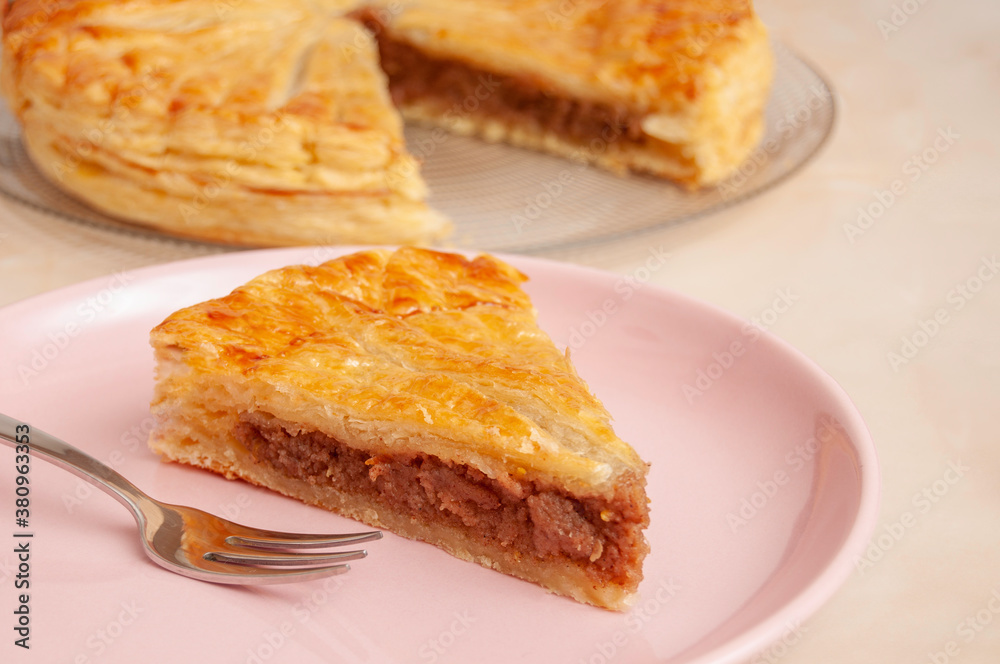 Pastry dough Galette des Rois with cream frangipane with white overground almond 