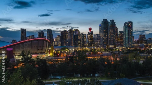 Day to night timelapse view of Calgary skyline showing high rise buildings in the financial district, Calgary, Alberta, Canada, zoom in.  photo