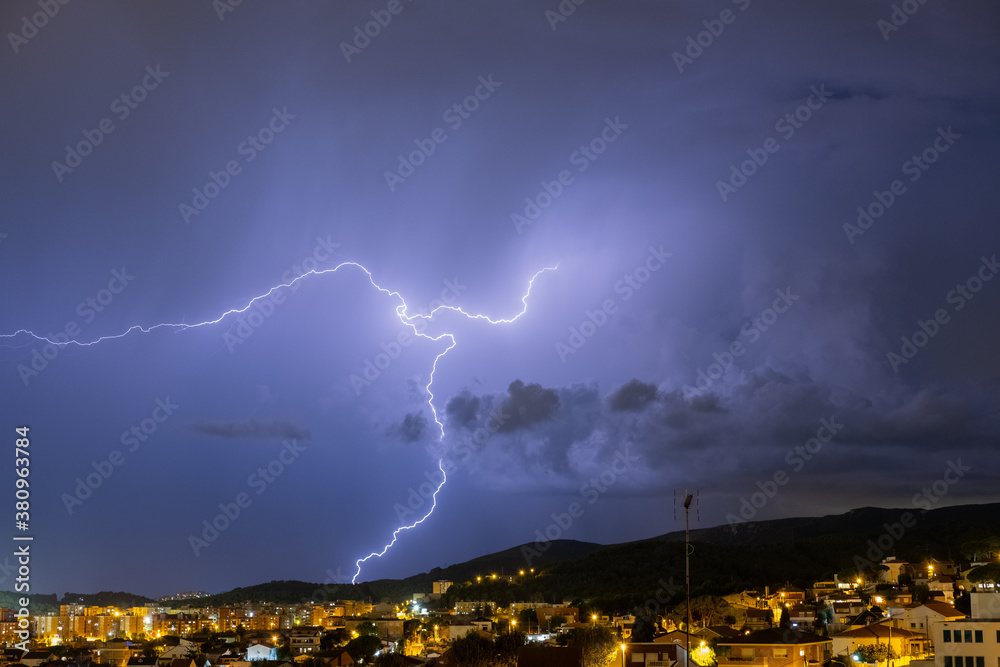 The lightning in the night sky over the city. The lightning in the night sky over the city.