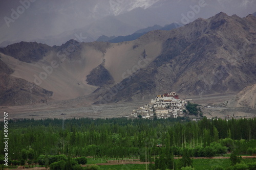 Thikse Gompa,  Thikse Monastery, Ladakhi, Tiksey, Thiksey or Thiksay, gompa, Tibetan-style monastery, Leh, Ladakh,  India with mountains and blue sky photo