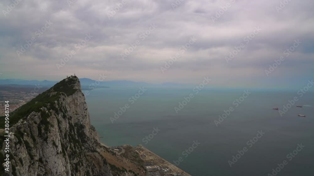 Panoramic view from the top of Gibraltar showing ships in the ocean and the port city Panoramic view from the top of Gibraltar showing ships in the ocean and the port city