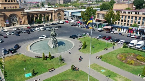 Aerial view the statue of David of Sasun near railway station. View on 
 Armenian flag from left. Park near statue. photo