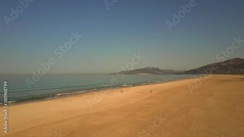 4K Aerial View Shot From Flying Drone Of The Coast With People Walking In Gibraltar