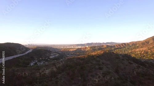 An aerial look of the suburban landscape through the hills of Glandale, California with downtown Los Angeles in the background photo