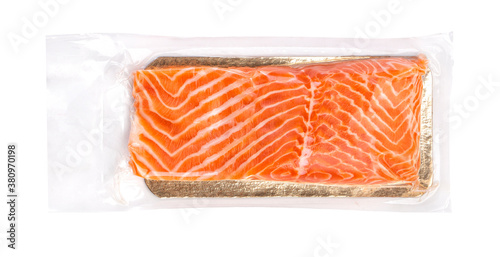 Vacuum packed salmon portion fillet isolated on white background photo