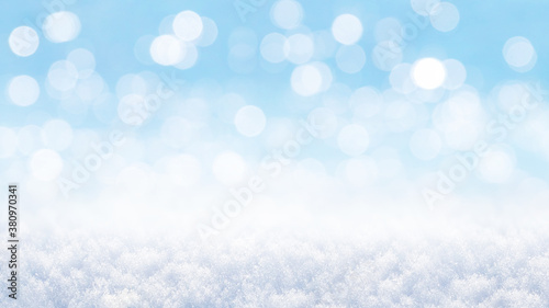 Christmas and New Year winter background with snow and bokeh out of focus © Volodymyr