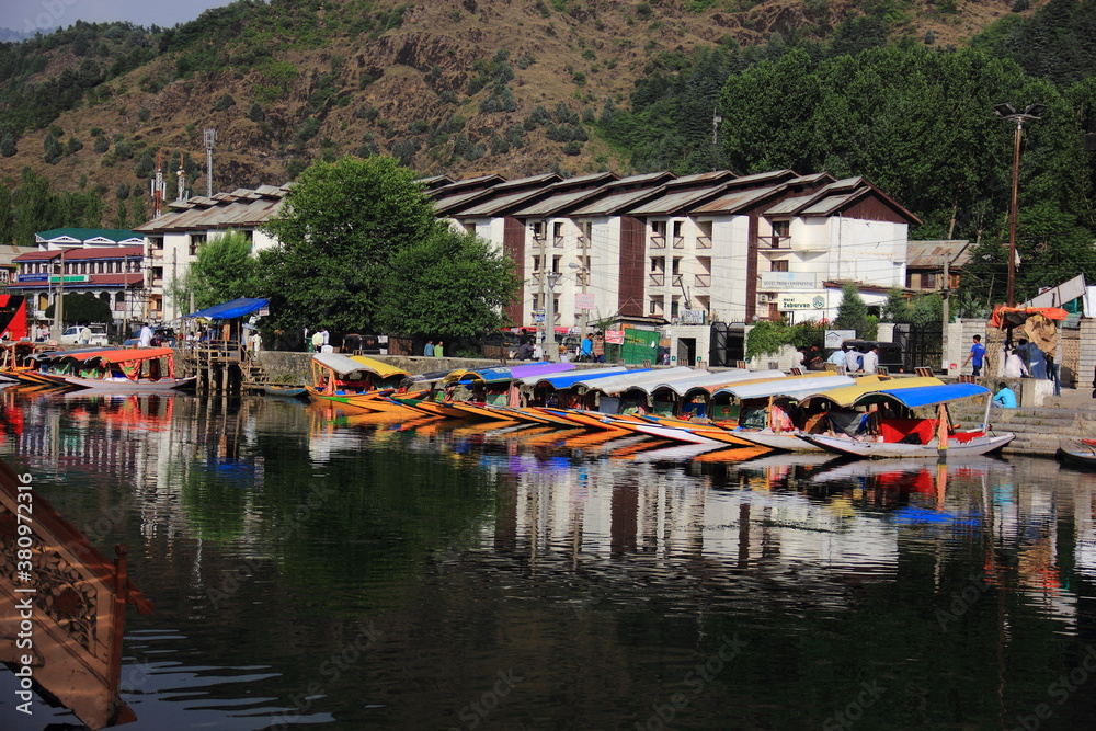 Dal is a lake in Srinagar, the summer capital of Jammu and Kashmir, India. Its a waterbody with beautiful mountains in background Dal is a lake in Srinagar, the summer capital of Jammu and Kashmir, India. Its a waterbody with beautiful mountains in background