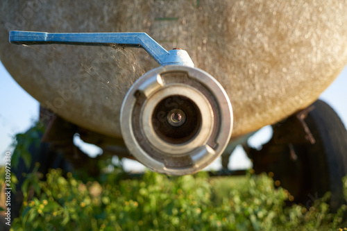 Close up of valve closure with bayonet connector from an agricultural manure trailer. Close-up. photo