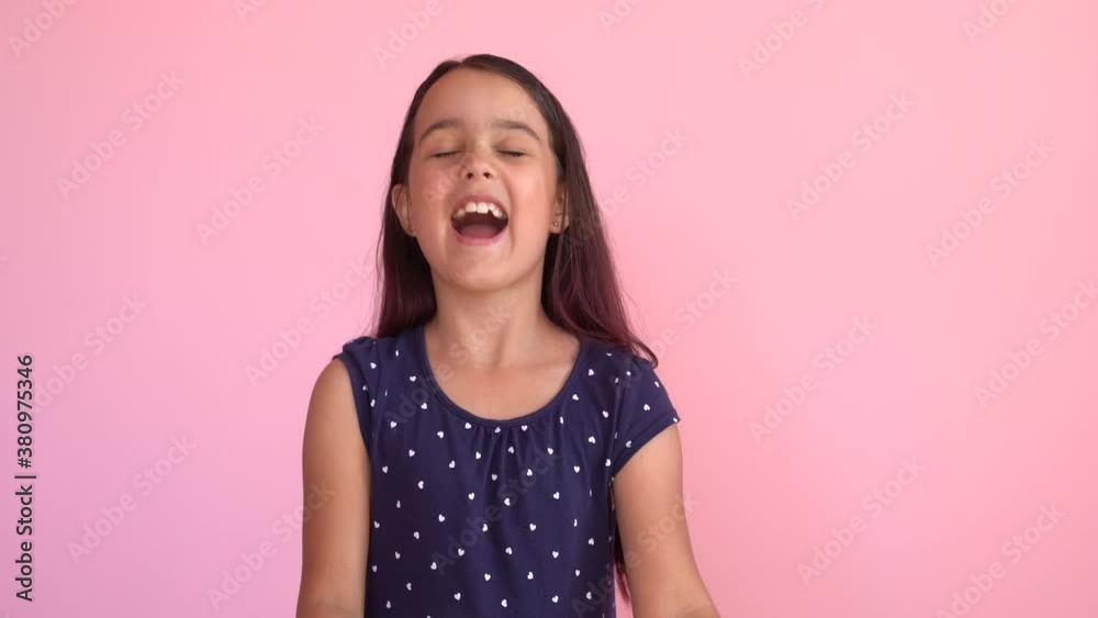 Little caucasian child girl receives money income in banknotes dollar cash. Happy kid having fun, smiling, looking at camera. Little caucasian child girl receives money income in banknotes dollar cash. Happy kid having fun, smiling, looking at camera.