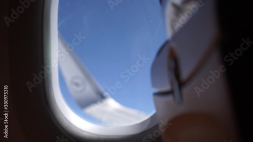 Airplane window view with focus pull photo
