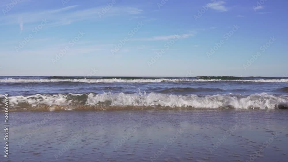 Dolly shot of sea waves in slow motion. Malvarossa beach, Valencia, Spain. Dolly shot of sea waves in slow motion. Malvarossa beach, Valencia, Spain.
