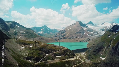 Catchment Lake in the Mountains with Wind Wheels Griessee Nufenenpass Switzerland photo