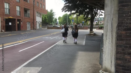 Wallpaper Mural two school girls walking slowly away from camera Torontodigital.ca