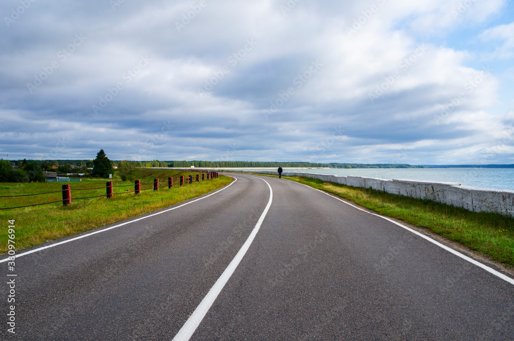 A beautiful automobile asphalt road without cars and people.