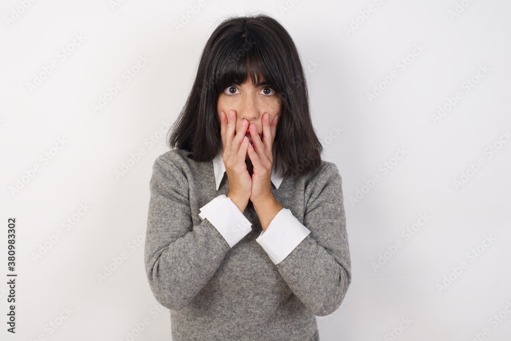 Young businesswoman with retro short hairdo wearing casual clothes standing over isolated white shocked with prices at shop, being short of money to buy something, People and human emotions concept Young businesswoman with retro short hairdo wearing casual clothes standing over isolated white shocked with prices at shop, being short of money to buy something, People and human emotions concept