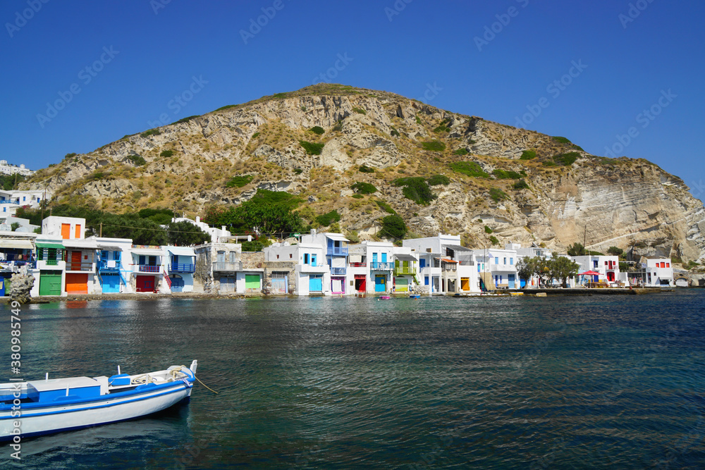 Fishing village seen from the water in Milos, Greece