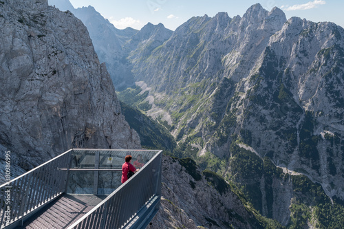 Tourist stay at the viewing platform around the mountain Alpspitze. photo