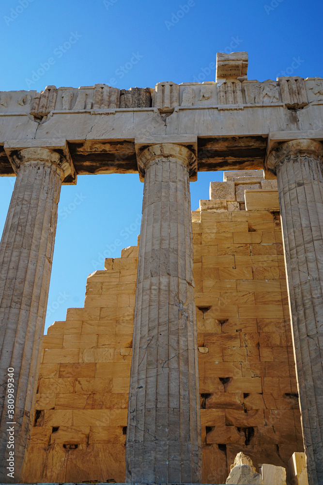 Columns and angled stone intersect at the Acropolis in Athens, Greece
