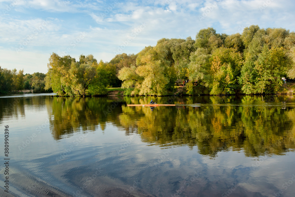 Sportsman kayaking on the river. Autumn landscape. Moscow river in Strogino, Moscow