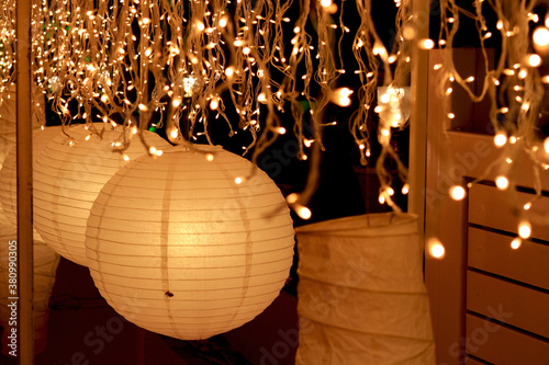 lighting in paper lantern decoration with bunch of small lights