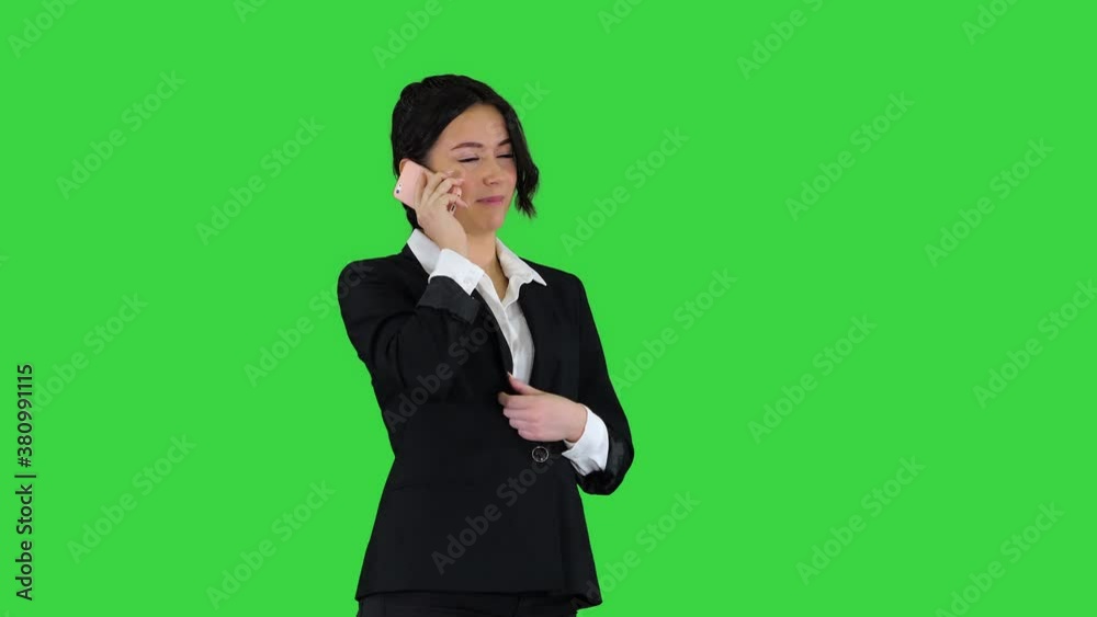 Business woman dancing after making a successful call on a Green Screen, Chroma Key. Business woman dancing after making a successful call on a Green Screen, Chroma Key.