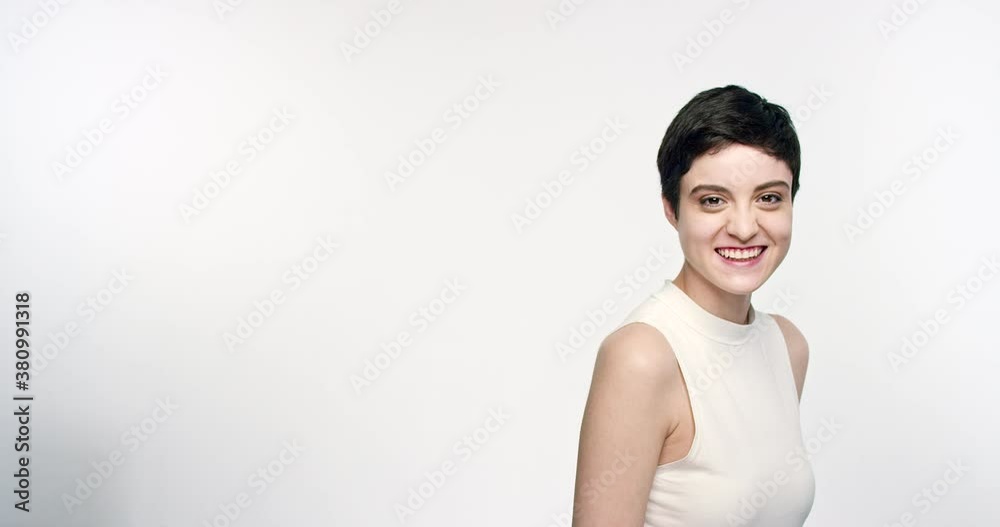 Wide shot of a teenage girls turning side to side looking at camera Wide shot of a teenage girls turning side to side looking at camera