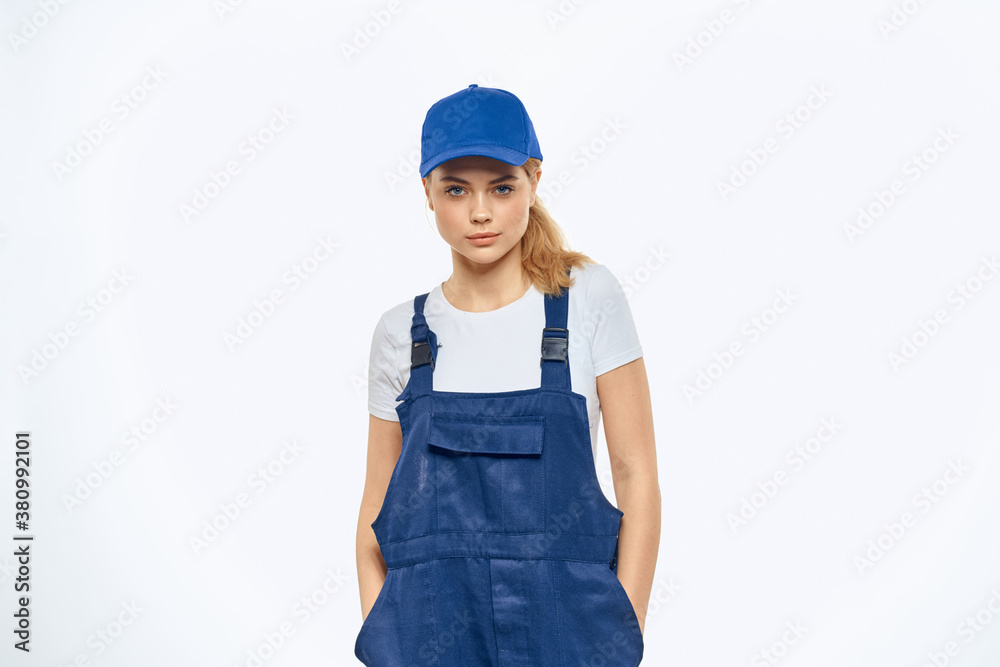 Woman in working uniform blue cap delivery courier delivery service Woman in working uniform blue cap delivery courier delivery service