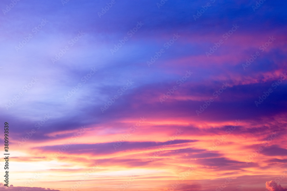 Colorful sky background in twilight after sunset, with magenta, blue and red