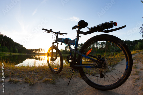Bicycle silhouette on nature side