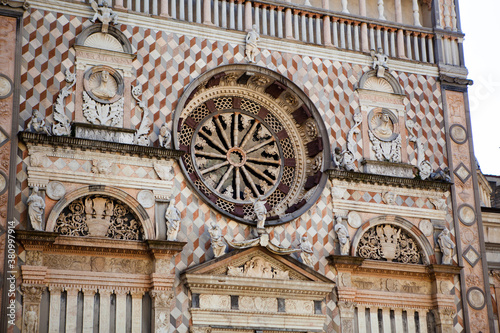 The Cappella Colleoni is a church & mausoleum in Bergamo, Lombardy, Northern Italy, dedicated to the saints of the Baptism religion. Close up view of the marble facade of the medieval cathedral.