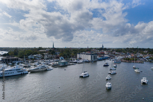 Aerial view of colorful sailboat moorings and docks on azure blue Spa Creek, in historic downtown Annapolis Maryland on a sunny summer day photo