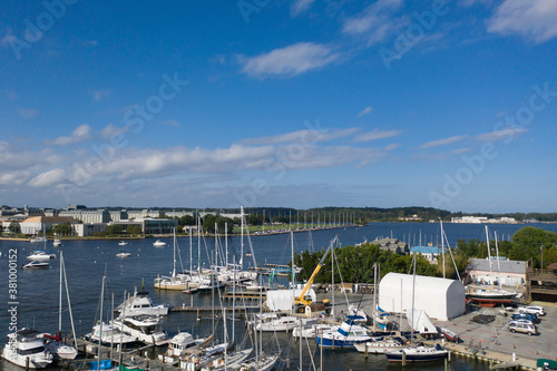 Aerial view of colorful sailboat moorings and docks on azure blue Spa Creek, in historic downtown Annapolis Maryland on a sunny summer day