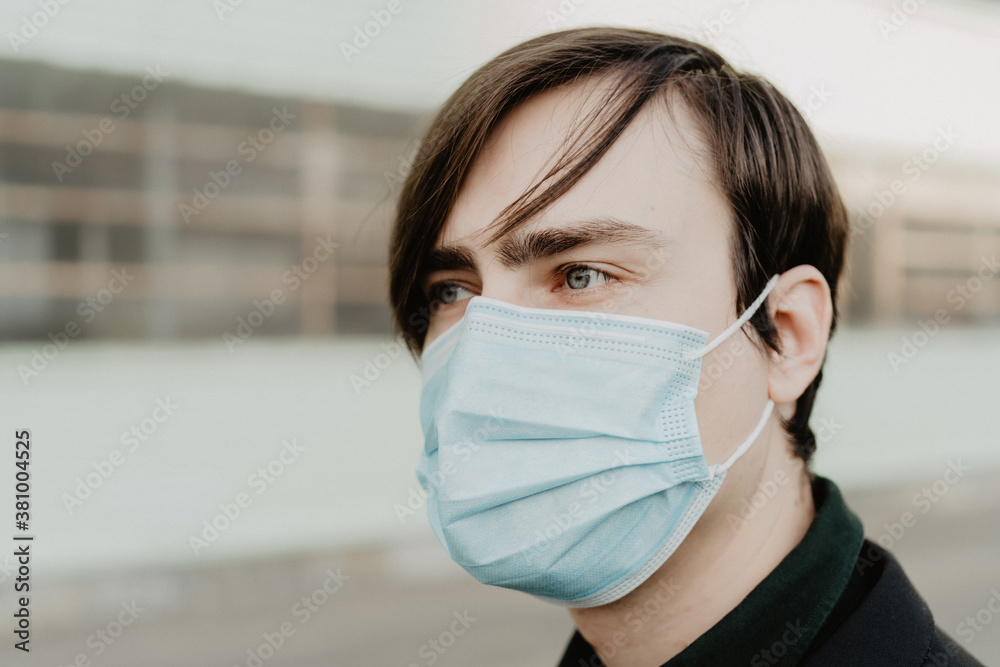 White young man in a medical mask. Coronavirus protection.