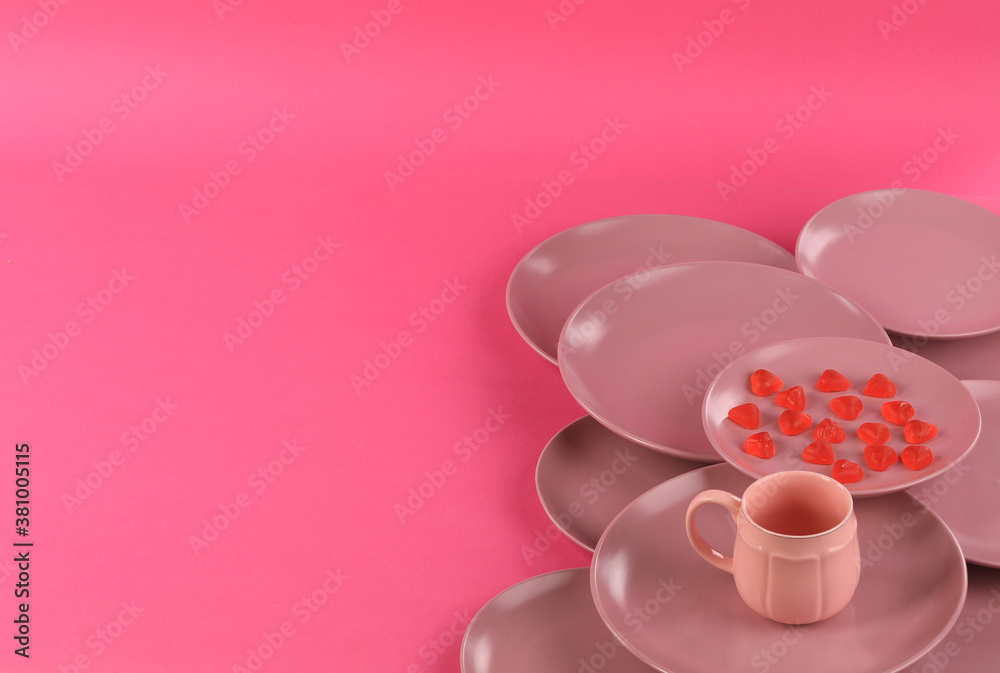 Fototapeta premium red kitchen ceramic plates isolated on red background