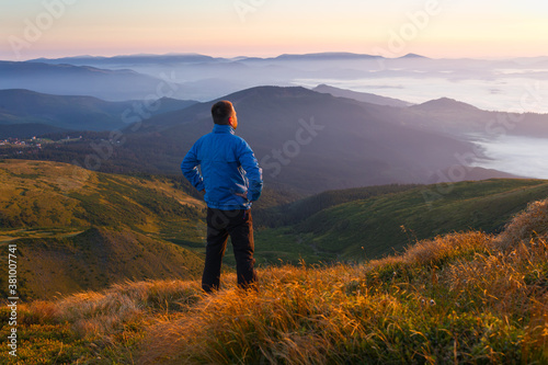 Man in the mountains looking into the distance