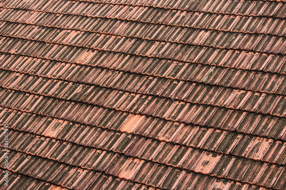 Texture of lines of terracotta tiles on the roof of a building Texture of lines of terracotta tiles on the roof of a building