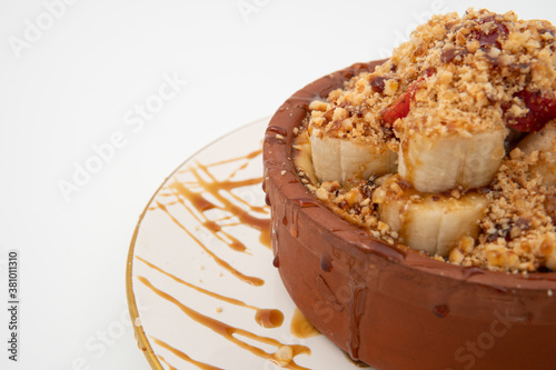 Turkish dessert rice pudding, banana strawberry and honey rice pudding, close up