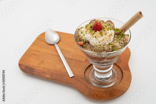 Turkish milk banana and strawberry dessert on wooden platter