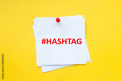 Word hashtag on white sticker with yellow background