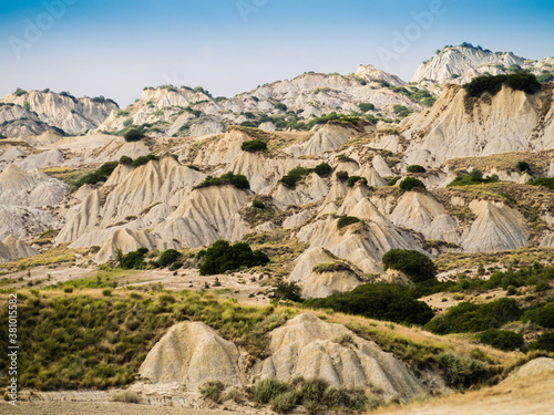 Dramatic view of Aliano badlands (calanchi), lunar landscape made of clay sculptures eroded by the rainwater, Basilicata region, southern Italy
 photo