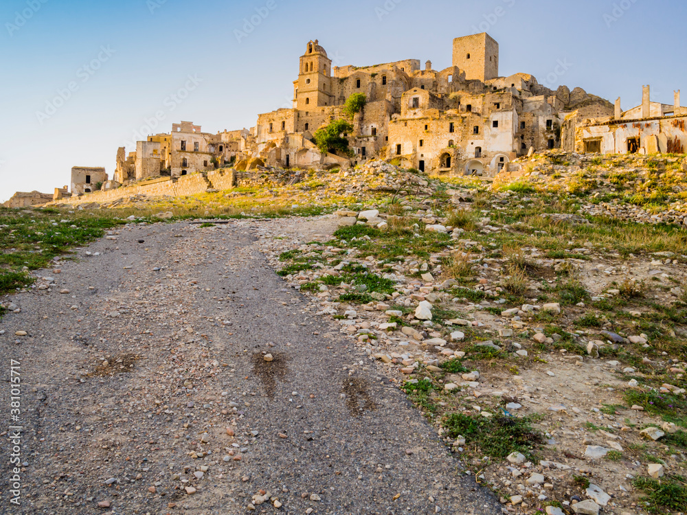 Dramatic view of Craco ruins, ghost town abandoned towards the end of the 20th century due to natural disaster, Basilicata region, southern Italy
