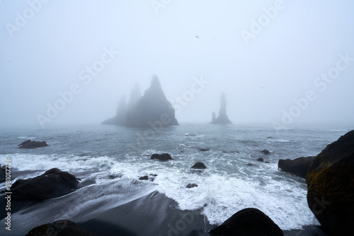 Icy beach in Iceland, Europe. Ice on the black volcanic sand on the Atlantic Ocean. Tourist attraction. Amazing landscape cloudy day. World beauty. 2020