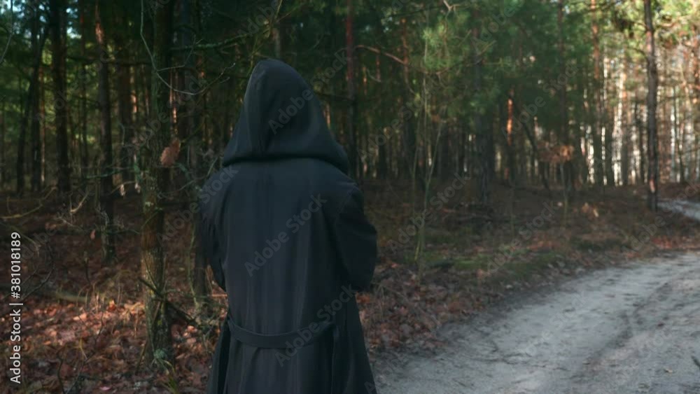 Wanderer in Black Cloak Cowl Walks Through Misty Forest. Wandering Monk Pilgrim. Autumn Morning. Mysterious Traveler. 2x Slow motion 60 fps 4K Wanderer in Black Cloak Cowl Walks Through Misty Forest. Wandering Monk Pilgrim. Autumn Morning. Mysterious Traveler. 2x Slow motion 60 fps 4K