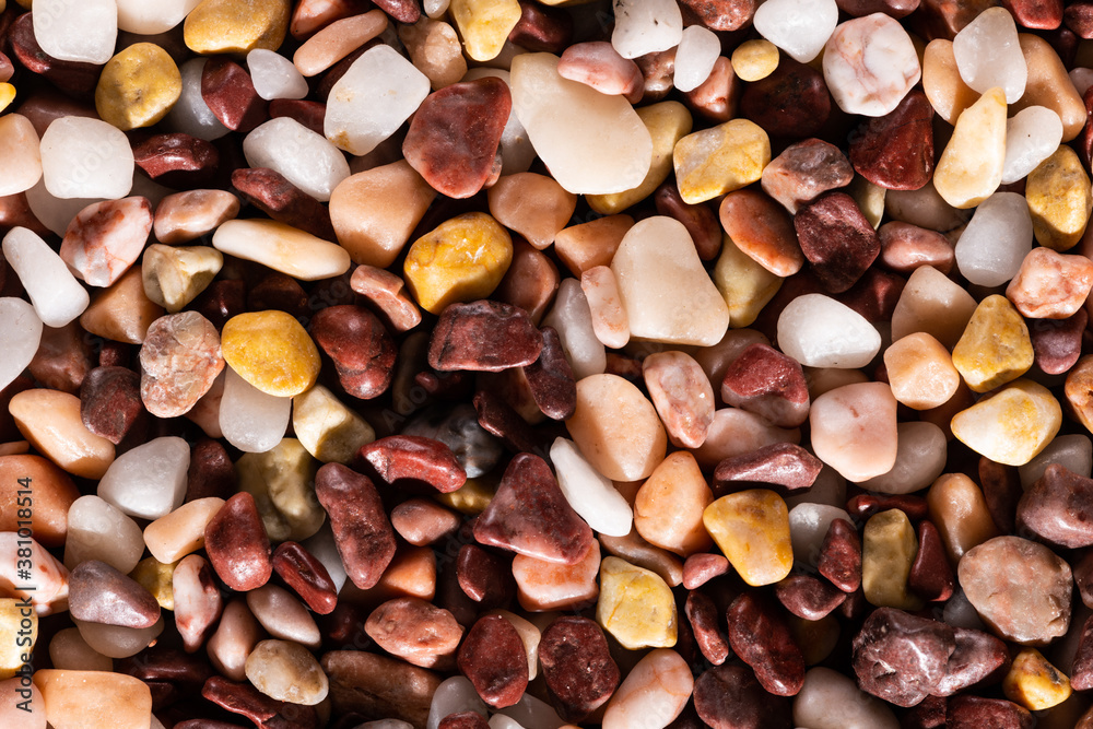 Multi-colored small river stones texture and background. Multi-colored small river stones texture and background.